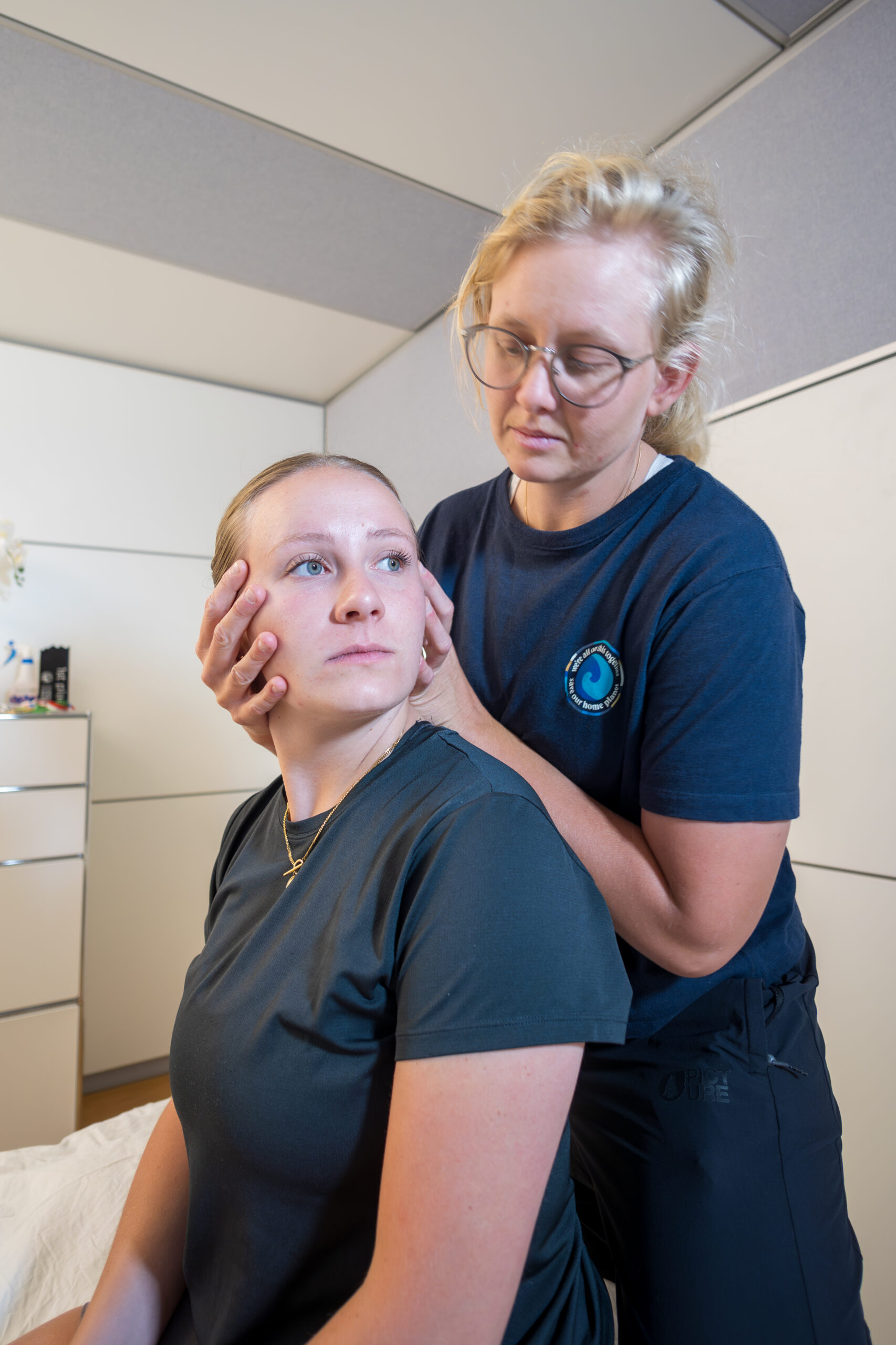 Specialist physiotherapist in Basel performing a cervical rotation test for vestibular disorders